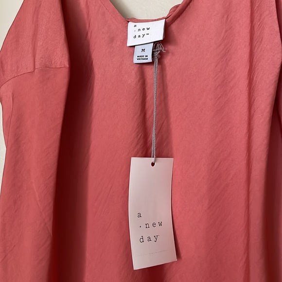 The oh so popular slip dress in coral. Beautiful with or without a jacket. - Picture 2 of 3